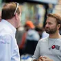 Daniel Negreanu chats with Pierre Neuville before start of play on Day 2