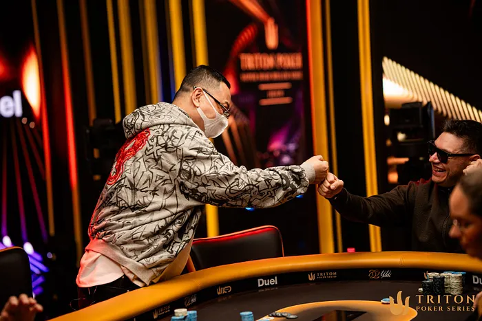 Liu Qiang & Alex Theologis share a sporting fist bump.
