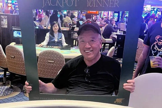 George poses after his jackpot win