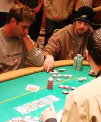 Fischman (right) counts out Wattel's chip stack to find out how much he owes