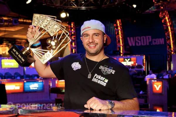 Michael Mizrachi holds aloft the David "Chip" Reese Trophy after winning his second $50,000 Poker Players' Championship in 2012