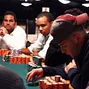Phil Ivey watches Joe Ward as he makes the call