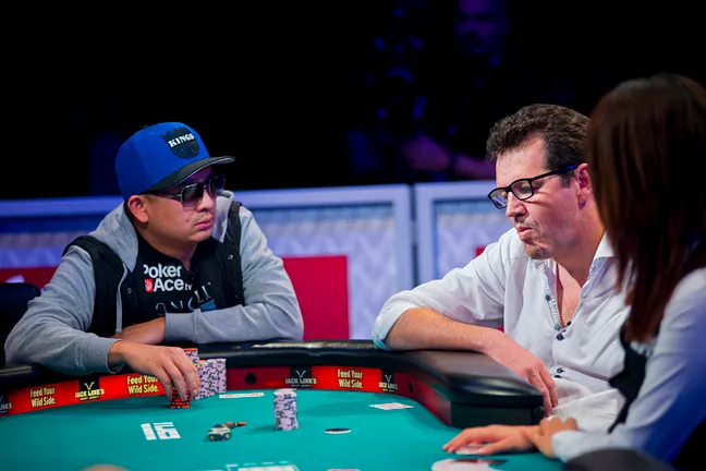 JC Tran, left, stares down an all-in Fabian Ortiz - 17th Place