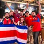 Humberto Brenes and friends celebrate Costa Rica's win in the World Cup