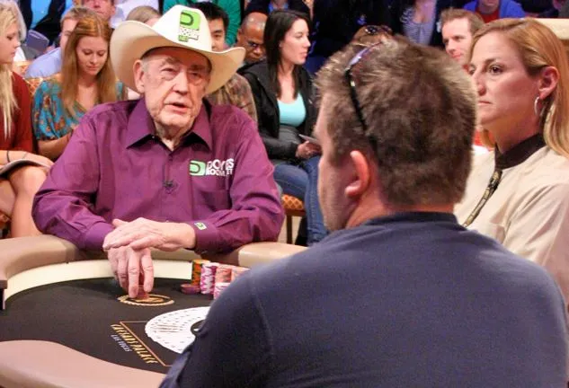 Doyle Brunson and Chris Moneymaker at the feature table.