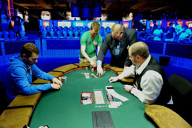 Matt Jarvis collecting chips after surviving a big all-in to retake the lead against Justin Filtz