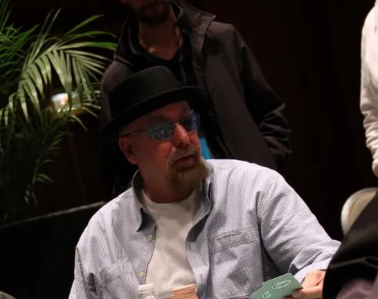 Cotton "Heisenberg" Snuffer Could Be a Problem Dog for Chip Leader Alex Queen, Sitting to His Left and Never Scared to Move His Chips