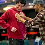 Daniel Negreanu patches up Jake Cody, the newest member of Team PokerStars.