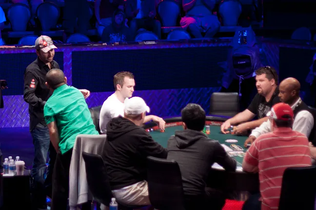Daniel Negreanu shakes Can Kim Hua's hand after busting him