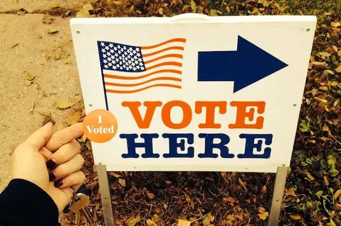 Sign with 'Vote Here' on it