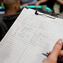 Tournament Director takes notes on hand for hand action