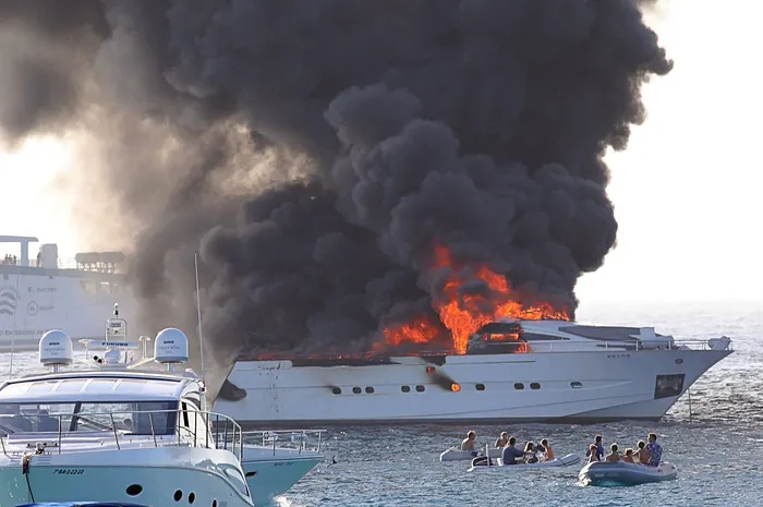 poker player burning yacht