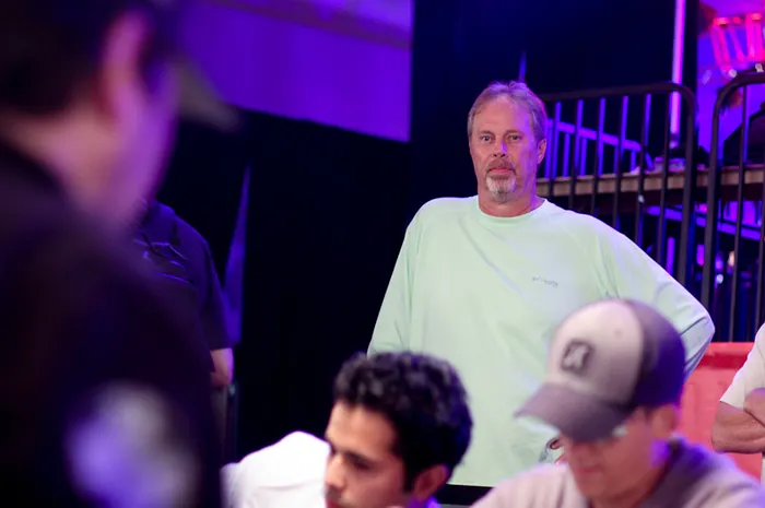 Paul Gilbert watched Phil Hellmuth in the Amazon Room.