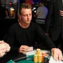 Chipleader Matt Perrins bags and tags his chips for the final table tomorrow