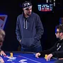Ole Schemion asks Georgios Sotiropoulos what hand he folded