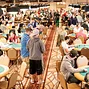 Players taking their seats for $1500 Pot Limit Hold Em