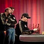 Daniel Negreanu and Jason Mercier look on at Phil Hellmuth heads up