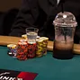 Players at table 300 prepare to celebrate making the money with a shot.