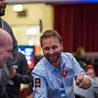 Daniel Negreanu shows his hand to the dealer