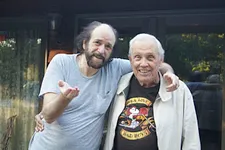 Dick Turnbull (right) with Mike Caro in front of the main house at Mike’s Ozarks hermitage.