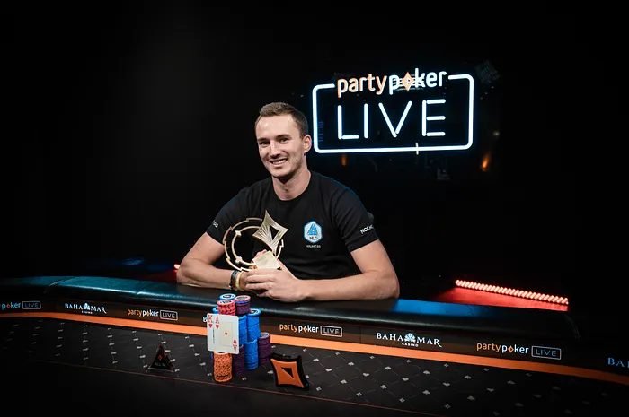 Steffen Sontheimer poses after his win in the CPP $250,000 Super High Roller Championships