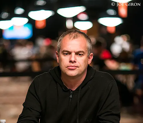 Aleksandr Denisov has almost half of the chips six-handed.