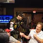 Phil Hellmuth greets the table