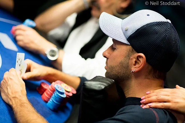 Daniel Negreanu holding his ace-king
