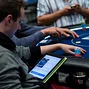Marc Etienne McLaughlin keeps up to date with the rest of the High Roller from PokerNews
