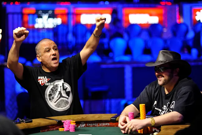 Eli Elezra cheers after winning a small pot as opponent, David Bach, is amused.