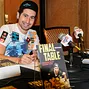 Jonathan Duhamel signing copies of his book "Final Table"