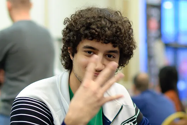 Jonathan Aguiar either flashing gang signs or telling us how many NAPT cashes he'll have after today
