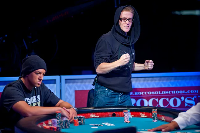 Charles Coultas, right, fist pumps after hitting his flush on the turn to eliminate Lasell King, left