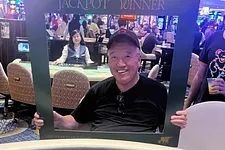 George poses after his jackpot win