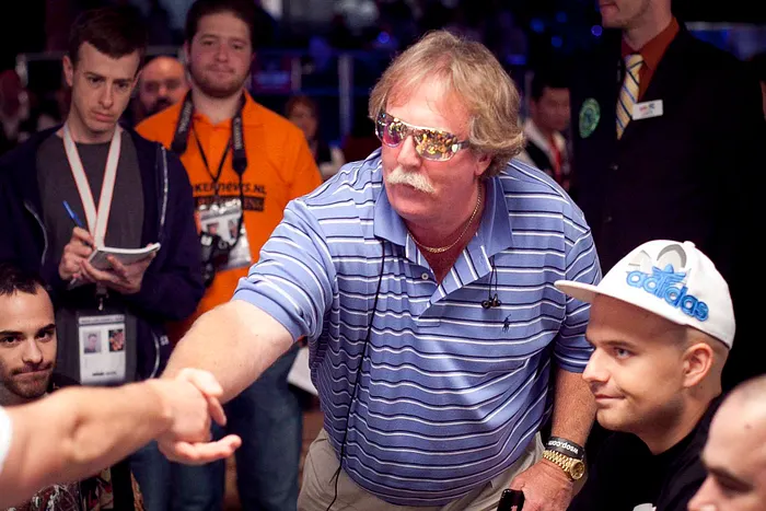 Tim Mcdonald Congratulates his table on making the money