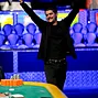 Elie Payan throws his arms up in victory after winning event 22.