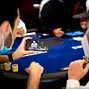 Players watch Phil Hellmuth hand
