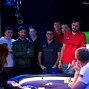 Players watch on as the flop is dealt