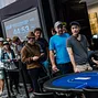 High Roller players line up to receive their seating assignment