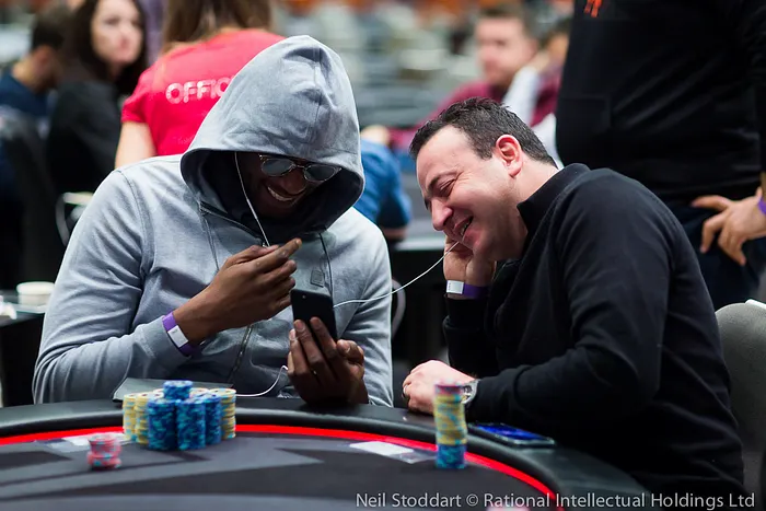 Kalidou Sow (L) shares his headphones