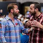 Daniel Negreanu takes time to pose with a fan for a photo