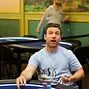 Dan O'Brien watches the chip flip right in front of him with intense focus