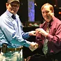 Sam Barnhart being present the WSOP-C gold ring by Tournament Director Jimmy Sommerfeld.