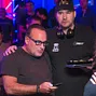 Dan Shak consoled by Phil Hellmuth after busting on the money bubble