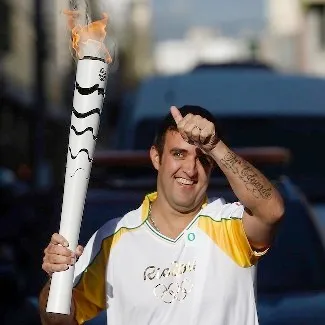 Andre Akkari Carrying The Olympic Torch