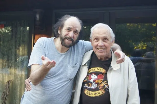 Dick Turnbull (right) with Mike Caro in front of the main house at Mike’s Ozarks hermitage.