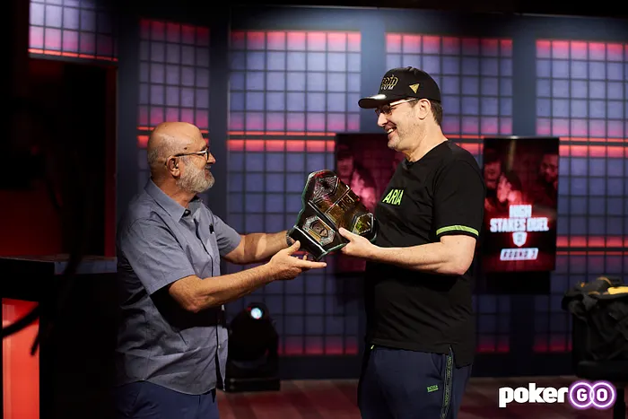 Mori Eskandani awards Hellmuth the High Stakes Duel II Championship Belt