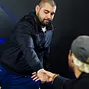 Simeon Naydenov shakes hands with his tablemates after busting