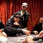 Phil Hellmuth wins a big one against Vanessa Selbst, while Daniel Negreanu looks over. 