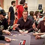 Phil Hellmuth and Scott Seiver mixing it up at the table. 